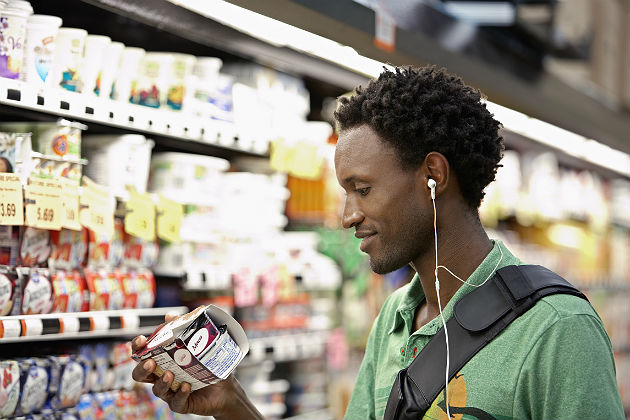Shopper amid inflation rising prices in 2026, highlighting impact on food prices and cost of living.
